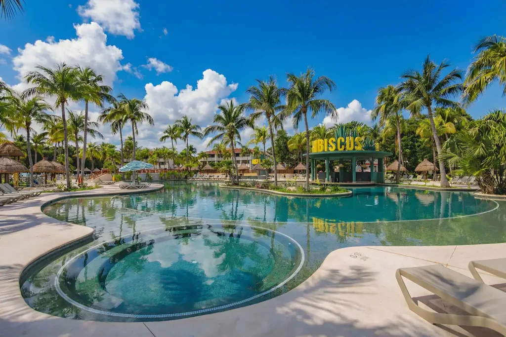 Pool and Hibiscus swim-up bar at Bahia Principe Escape Tequila, home base for our singles vacation Cancun trip